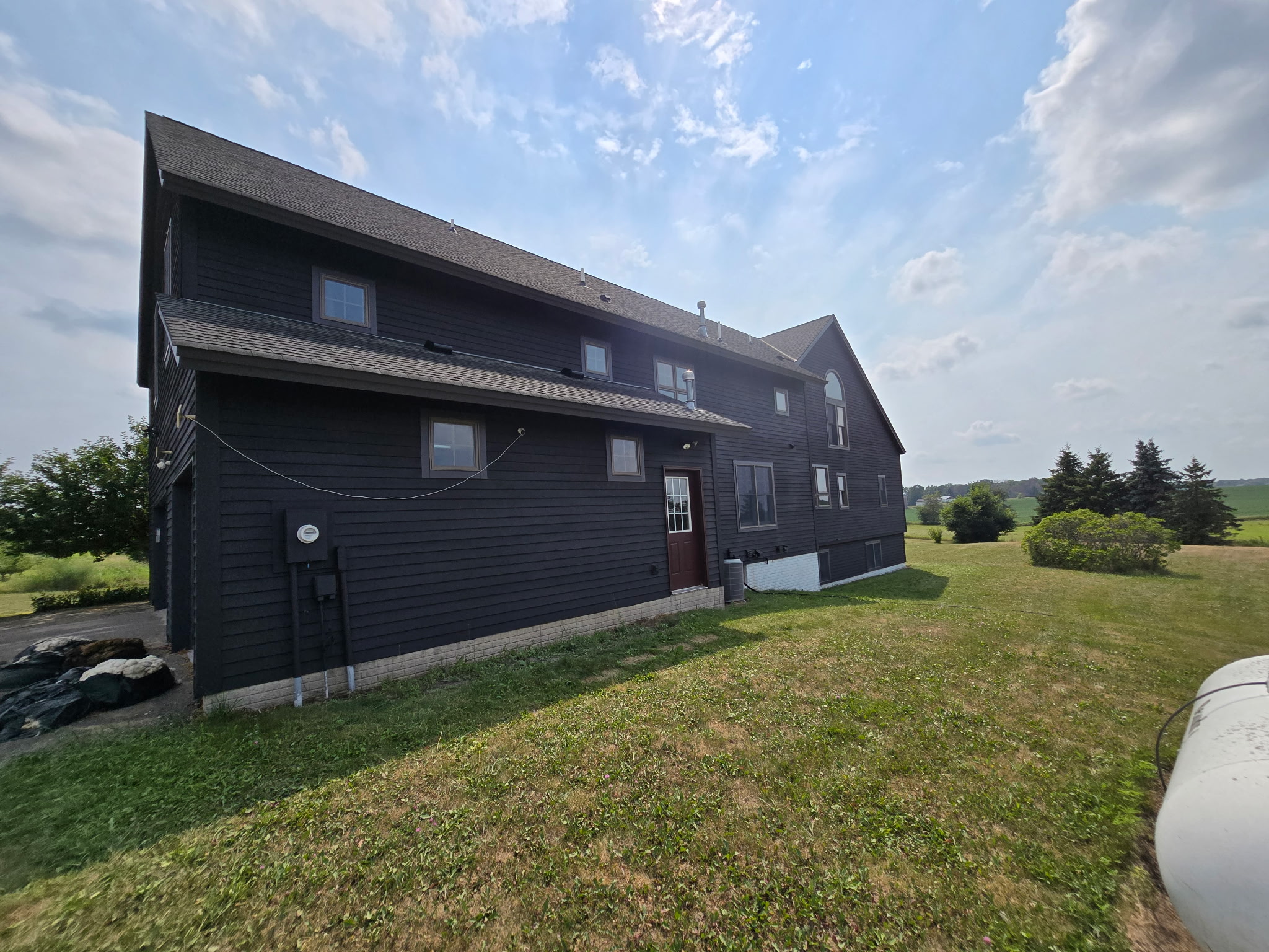 Black Wood Siding Maintenance on a Dayton Farmhouse