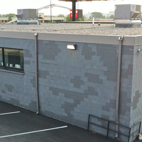 Commercial cinder block wall before masonry coating and facade refresh in St. Louis Park