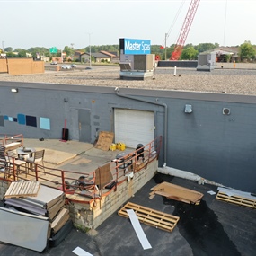 Rear commercial wall and loading area before block sealing and exterior painting in St. Louis Park