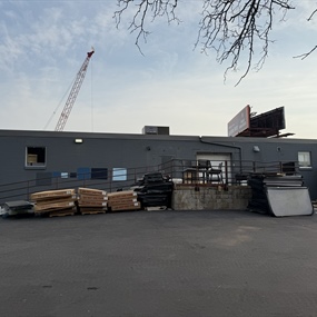 Commercial block building before facade painting for Master Spas in St. Louis Park, MN