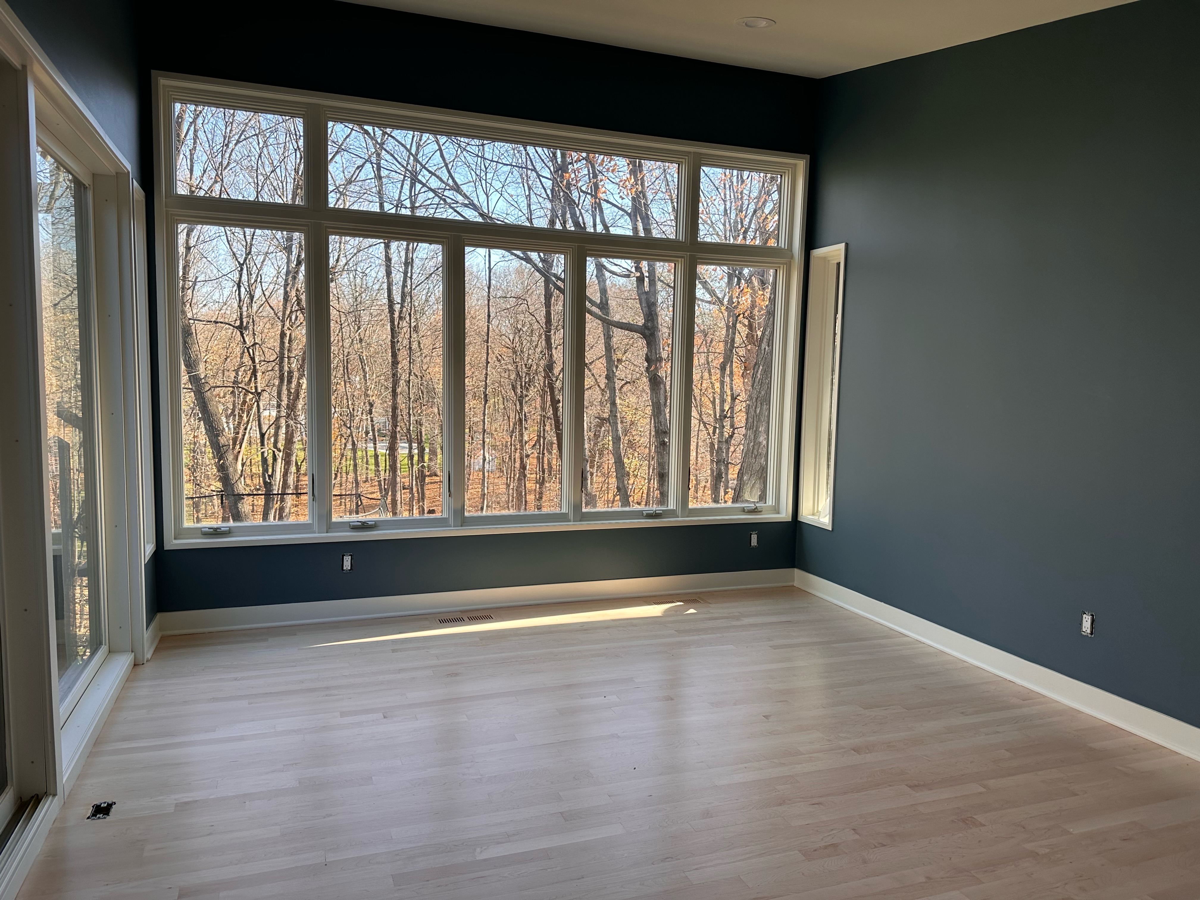 Interior painting project with navy blue walls